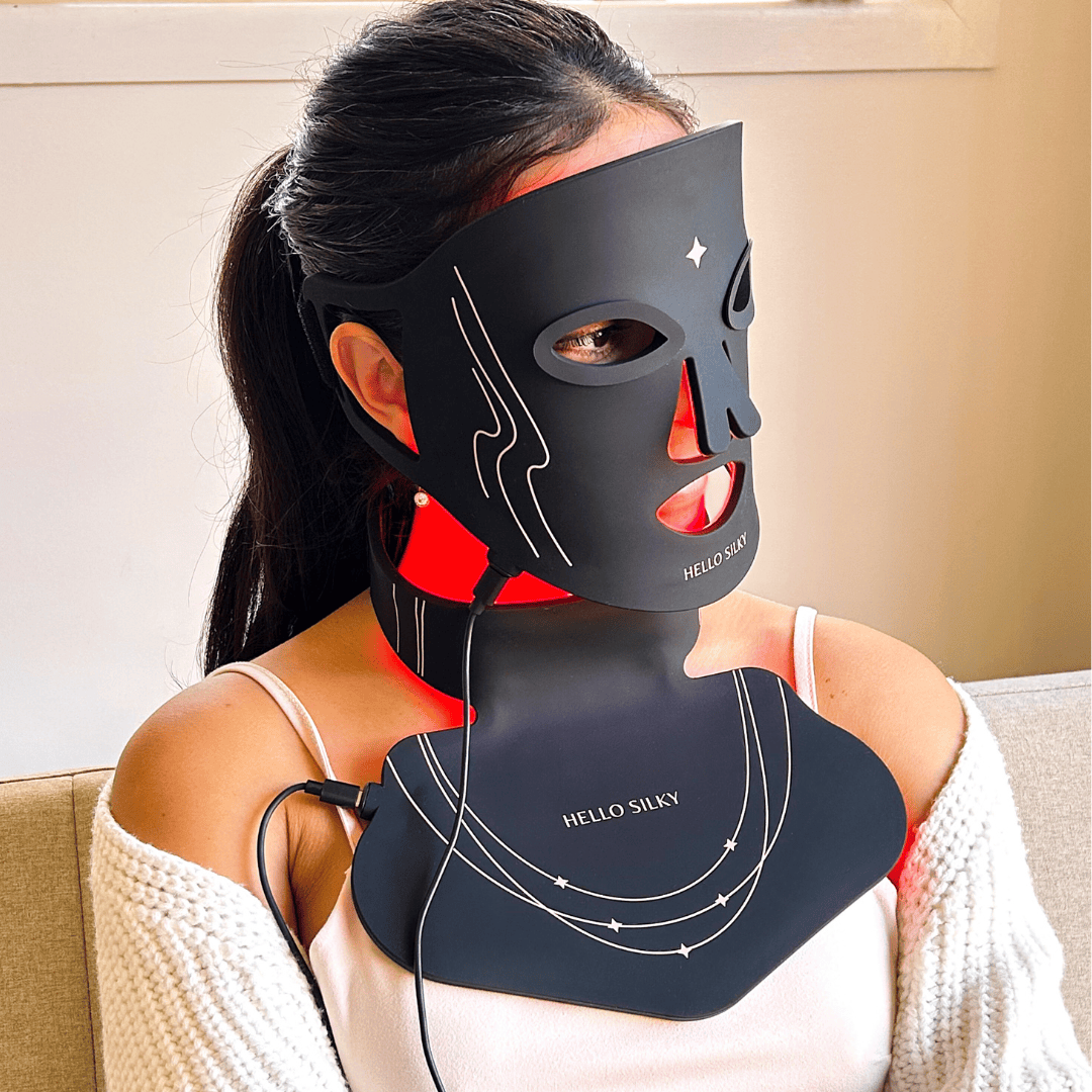Hello Silky LED light therapy mask PLUS, for  face and neck, designed for anti-aging and skin rejuvenation. The black silicone mask covers the face and neck, emitting red light to stimulate collagen production, reduce wrinkles, reduce acne breakouts and improve skin tone. Ideal for at-home light therapy treatments, this innovative beauty device targets common signs of aging, offering a convenient and non-invasive skincare solution. 